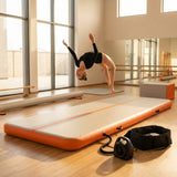 Inflatable gymnastics mat in orange and grey designed for home and gym use