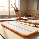 Inflatable gymnastics mat in orange and grey designed for home and gym use