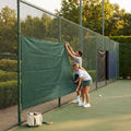 Green Tennis Court Windbreaks on an outdoor tennis court