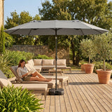 Double-sided garden parasol providing outdoor shade with steel frame