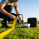 Elastic line marking tape in white, yellow, and blue for sports pitches