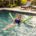 Colourful swimming pool noodles made from EVA foam