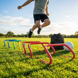 Adjustable foam hurdles in red, yellow, green, and blue for young athletes