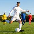 Men's football kit in various colours, including long-sleeve shirt, shorts, and socks