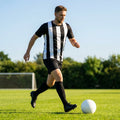 Men's striped football kit with shirt, shorts, and socks