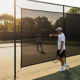 Green Tennis Court Windbreaks on an outdoor tennis court