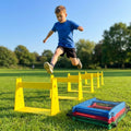 Adjustable foam hurdles in red, yellow, green, and blue for young athletes