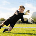 Hybrid goalkeeper gloves in white and black with neoprene backhand