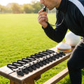 Black sports whistle with lanyard for school and club use