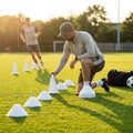 Set of vibrant football training cones in various sizes and colours