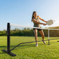 Pickleball posts with base plates in blue, black, and green for club use