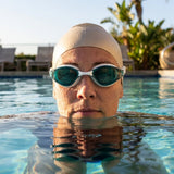 Swimming goggles available in black, grey, and white with anti-fog lenses
