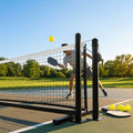 Pickleball posts with base plates in blue, black, and green for club use