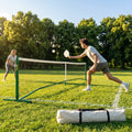 Pickleball posts with base plates in blue, black, and green for club use