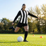 Women's football kit with long-sleeved striped shirt, shorts, and knee-high socks