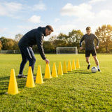 Set of vibrant football training cones in various sizes and colours